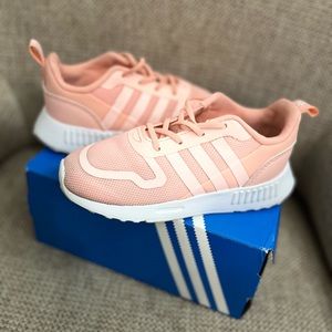 Great condition/ used only a couple of times. Peach color Adidas.